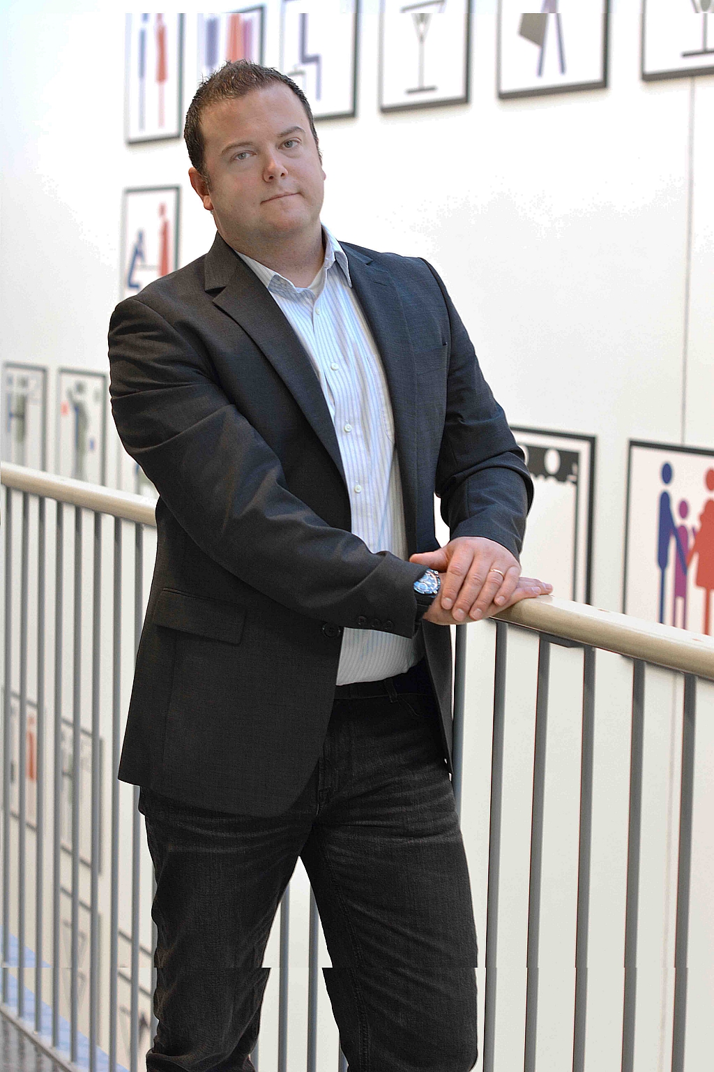 Man wearing suit looking towards camera