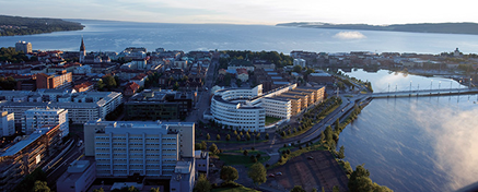 Drone photo with campus in the foreground and Jönköping and Lake Vättern in the background