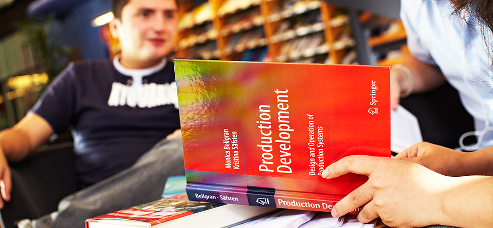 Student reading course literature in the library